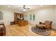 The office is furnished with a large wooden desk and a leather chair with an ottoman at 20635 Queensdale Dr, Cornelius, NC 28031