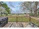 Spacious deck overlooking a lush backyard with a storage shed at 209 Vanderbilt Ave, China Grove, NC 28023