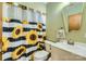 Stylish bathroom with a sunflower shower curtain and modern fixtures at 209 Vanderbilt Ave, China Grove, NC 28023