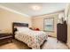 Comfortable bedroom with a cozy bed and natural light from the window at 209 Vanderbilt Ave, China Grove, NC 28023