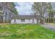 Charming ranch home with a well-maintained front lawn and convenient carport at 209 Vanderbilt Ave, China Grove, NC 28023
