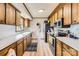 Well-lit kitchen featuring stainless steel appliances and ample cabinet space at 209 Vanderbilt Ave, China Grove, NC 28023