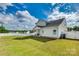 Spacious backyard with manicured lawn, a covered patio, and a full perimeter fence at 2222 Smoltz Dr, Rock Hill, SC 29730