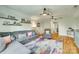 Spacious living room featuring a sectional sofa, ceiling fans, and a colorful area rug at 2222 Smoltz Dr, Rock Hill, SC 29730