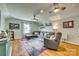 Cozy living room featuring a large sectional sofa, ceiling fans, and hardwood floors at 2222 Smoltz Dr, Rock Hill, SC 29730