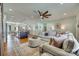 Open living space with hardwood floors, a large kitchen island, comfortable seating, and stylish decor at 2222 Smoltz Dr, Rock Hill, SC 29730