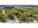 Aerial view of home surrounded by green trees along a road intersection at 2300 Linwood Rd, Gastonia, NC 28052