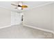Bedroom featuring crown molding, a ceiling fan, and a closet with doors at 2300 Linwood Rd, Gastonia, NC 28052
