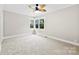 Bedroom featuring crown molding, a ceiling fan, and a corner window offering natural light at 2300 Linwood Rd, Gastonia, NC 28052
