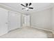 Bedroom with neutral walls, a ceiling fan, and a closet with double doors at 2300 Linwood Rd, Gastonia, NC 28052