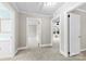 Bright hallway featuring neutral walls, carpet, and multiple doorways leading to other rooms at 2300 Linwood Rd, Gastonia, NC 28052