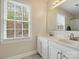 Bathroom featuring a double sink vanity, a large window and bright natural lighting at 2812 Edgebrook Cir, Matthews, NC 28105