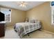 Comfortable bedroom features neutral tones, natural light, and calm decor at 2812 Edgebrook Cir, Matthews, NC 28105
