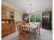 Elegant dining room with a wooden table, a hutch, and a chandelier, perfect for hosting dinner parties at 2812 Edgebrook Cir, Matthews, NC 28105
