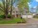 Charming two-story home with a well-manicured lawn, mature trees, and a two-car garage, offering classic curb appeal at 2812 Edgebrook Cir, Matthews, NC 28105