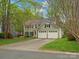 Traditional two-story home with a two-car garage, well-manicured lawn, and mature landscaping at 2812 Edgebrook Cir, Matthews, NC 28105