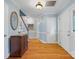 Welcoming foyer with hardwood floors, a decorative mirror, and views of the staircase at 2812 Edgebrook Cir, Matthews, NC 28105