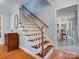 Beautiful staircase leads to a bright and airy home with hardwood floors at 2812 Edgebrook Cir, Matthews, NC 28105