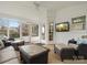Inviting sunroom with screened windows, comfortable seating and TV at 2812 Edgebrook Cir, Matthews, NC 28105