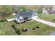 Aerial view of a well-maintained home with lush landscaping, a spacious yard, and mature trees at 2987 Irish St, Newton, NC 28658