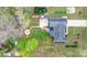 Aerial view of property showcasing well-maintained backyard, patio, firepit, and mature trees at 2987 Irish St, Newton, NC 28658