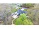 Bird's eye view of the property, highlighting the deck, patio area, and surrounding greenery at 2987 Irish St, Newton, NC 28658