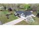 Overhead view of a lovely home featuring a manicured lawn, a long driveway, and a beautiful blooming tree at 2987 Irish St, Newton, NC 28658