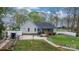 Home backyard featuring a garden, a deck, and a white fence at 2987 Irish St, Newton, NC 28658