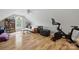 Bonus room with light hardwood floors, a window, a sofa, and workout equipment at 2987 Irish St, Newton, NC 28658