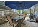 Outdoor deck area with a table, chairs, and blue umbrella at 2987 Irish St, Newton, NC 28658