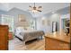 Spacious main bedroom with vaulted ceiling, wood floors, and great natural light at 2987 Irish St, Newton, NC 28658