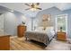 Main bedroom featuring wood floors and a ceiling fan at 2987 Irish St, Newton, NC 28658