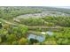Aerial view of community featuring tennis courts, walking paths, and surrounded by mature trees at 3038 Northampton Dr, Charlotte, NC 28210