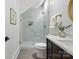 Modern bathroom boasts a sleek glass shower and stylish vanity at 3038 Northampton Dr, Charlotte, NC 28210