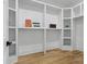 Spacious walk-in closet with custom shelving and hardwood floors at 3038 Northampton Dr, Charlotte, NC 28210