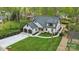 Stunning two-story home featuring a manicured lawn, black accents, and a two-car garage at 3038 Northampton Dr, Charlotte, NC 28210