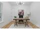 Modern home office with hardwood floors, neutral walls, and stylish desk at 3038 Northampton Dr, Charlotte, NC 28210