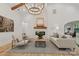 Spacious living room with a stone fireplace, high ceilings, and comfortable seating at 3038 Northampton Dr, Charlotte, NC 28210