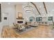 Bright living room featuring a modern fireplace, wood beams, and an open floor plan at 3038 Northampton Dr, Charlotte, NC 28210