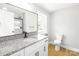 Bathroom features vanity, granite counters, and tile backsplash at 307 S Ransom St, Gastonia, NC 28052