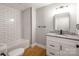 Bathroom with modern subway tile and a granite vanity and modern fixtures at 307 S Ransom St, Gastonia, NC 28052