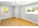 Bright bedroom featuring wood laminate flooring, natural light and neutral paint at 307 S Ransom St, Gastonia, NC 28052