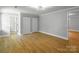 Spacious light gray bedroom with wood-look floors at 307 S Ransom St, Gastonia, NC 28052