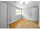 Well-lit bedroom shows bright trim and wood-look flooring at 307 S Ransom St, Gastonia, NC 28052