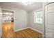 Bedroom view showcasing wood floors and connection to the kitchen at 307 S Ransom St, Gastonia, NC 28052
