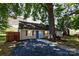 Inviting one-story house with a cozy front yard, complemented by a striking blue door at 307 S Ransom St, Gastonia, NC 28052