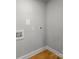 View of the laundry room featuring tile flooring and fresh paint at 307 S Ransom St, Gastonia, NC 28052