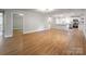 Open-concept living space with hardwood floors and seamless flow to the kitchen at 307 S Ransom St, Gastonia, NC 28052