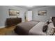 This bedroom features neutral tones and wood flooring with modern furnishing at 307 S Ransom St, Gastonia, NC 28052