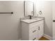 Powder room showcasing granite vanity, white cabinets, and modern black fixtures at 307 S Ransom St, Gastonia, NC 28052